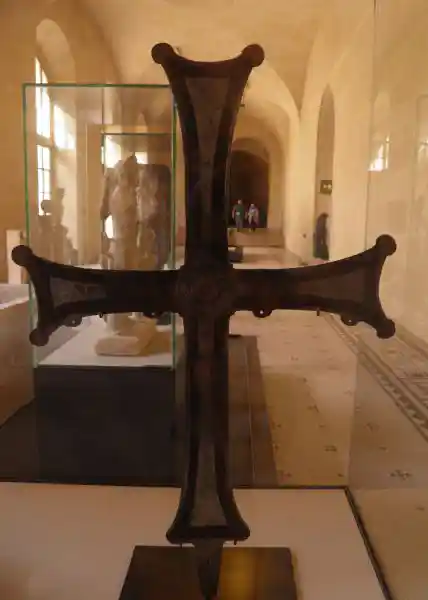 Early medieval bronze processional cross with engraved sun symbol decoration 